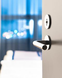 open door with a metal handle Commercial wood doors,Commercial interior wood doors, Commercial exterior wood doors, Commercial solid wood doors